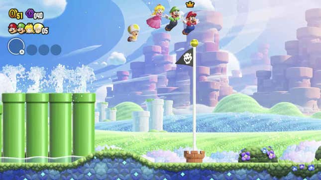 Желтая Жаба, Персик, Луиджи и Марио летают над флагом в Super Mario Bros. Wonder