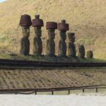 Statues at the base of a hillside on Easter Island.