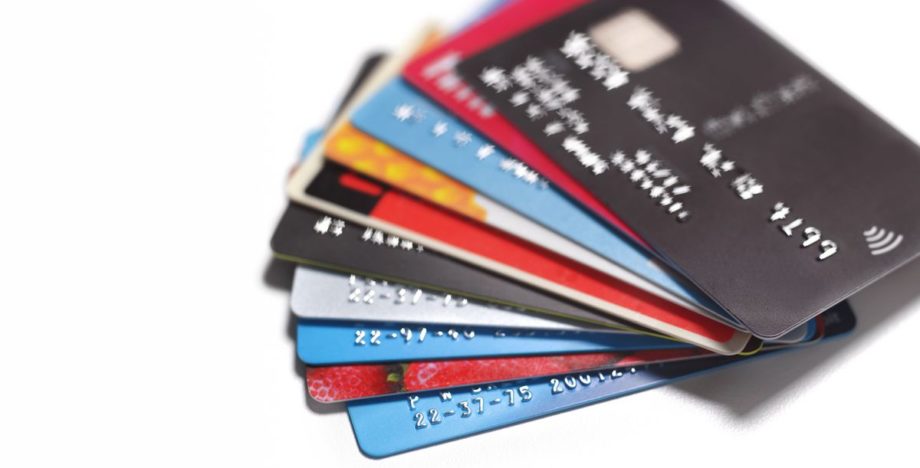 A fanned stack of credit cards. Researchers estimate that humans inhale a credit card