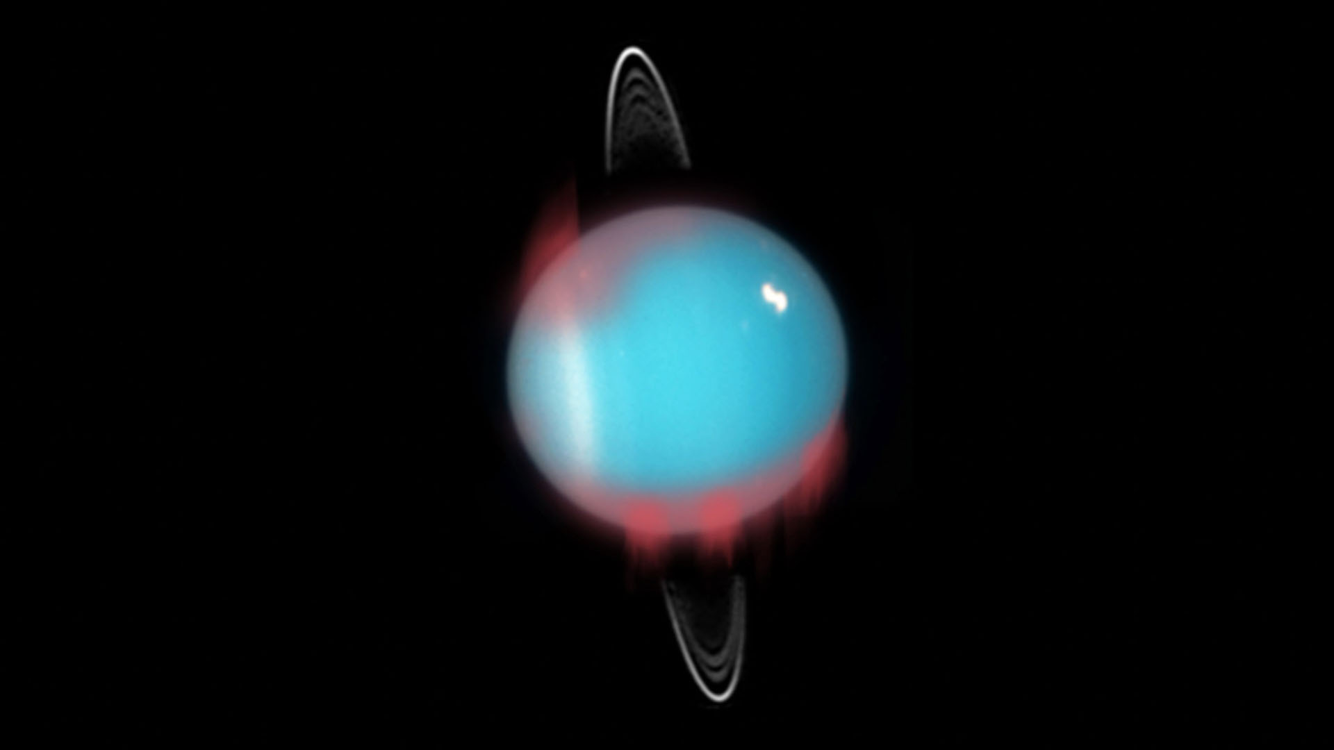 Впечатление художника от вновь обретенного инфракрасного сияния, наложенное на фотографию Урана, сделанную космическим телескопом Хаббл.