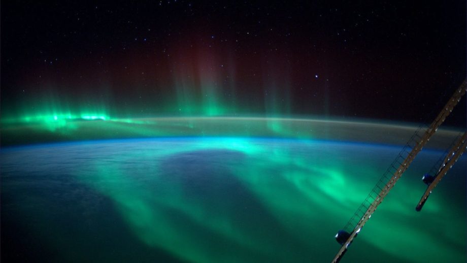 a photograph of a green aurora over the southern hemisphere