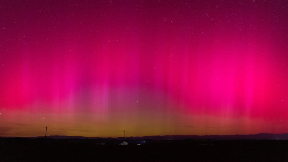 A photo of a bright pinkish-red aurora in China